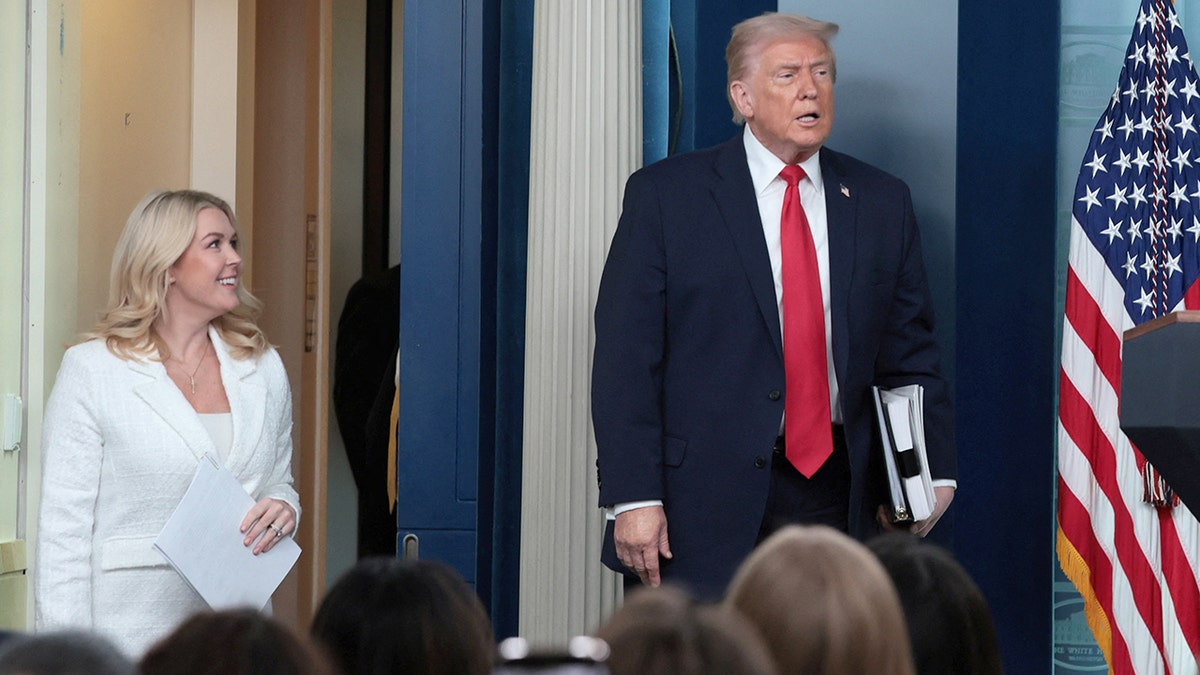 Donald Trump and Karoline Leavitt at White House press briefing