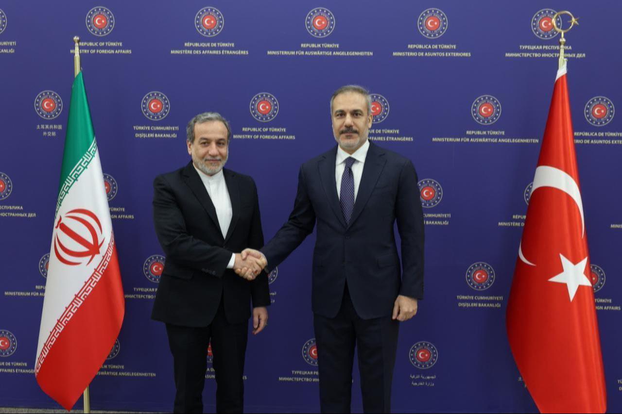 Turkish Foreign Minister Hakan Fidan (R) shakes hands with Iranian Foreign Minister Abbas Araghchi (L) as they pose for a photo prior to their meeting at the Foreign Ministry Headquarter in Ankara, Türkiye on Dec. 2, 2024. (AA Photo)