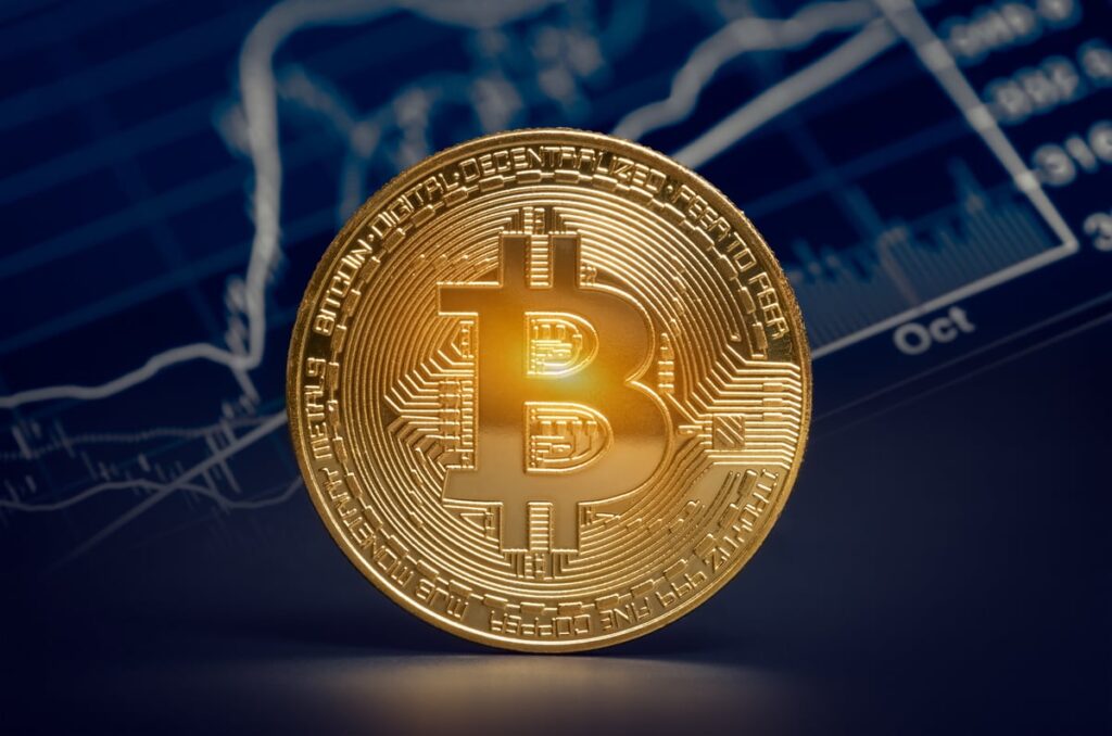 1 Spectacular Cryptocurrency That Could Soar by 1,159%, According to Cathie Wood A gold coin with the Bitcoin symbol on its face.
