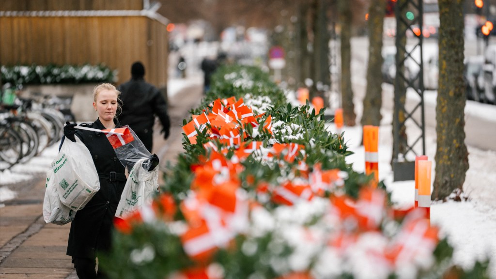 Maja Schlein Staal places Danish flags in front of the US embassy in Copenhagen, Denmark, on January 28, 2026. The flags are being placed in response to US President Donald Trump saying in an interview that NATO soldiers in Afghanistan "stayed back a little, a little away from the front line." (Photo by Emil Nicolai Helms / Ritzau Scanpix / AFP via Getty Images) / Denmark OUT