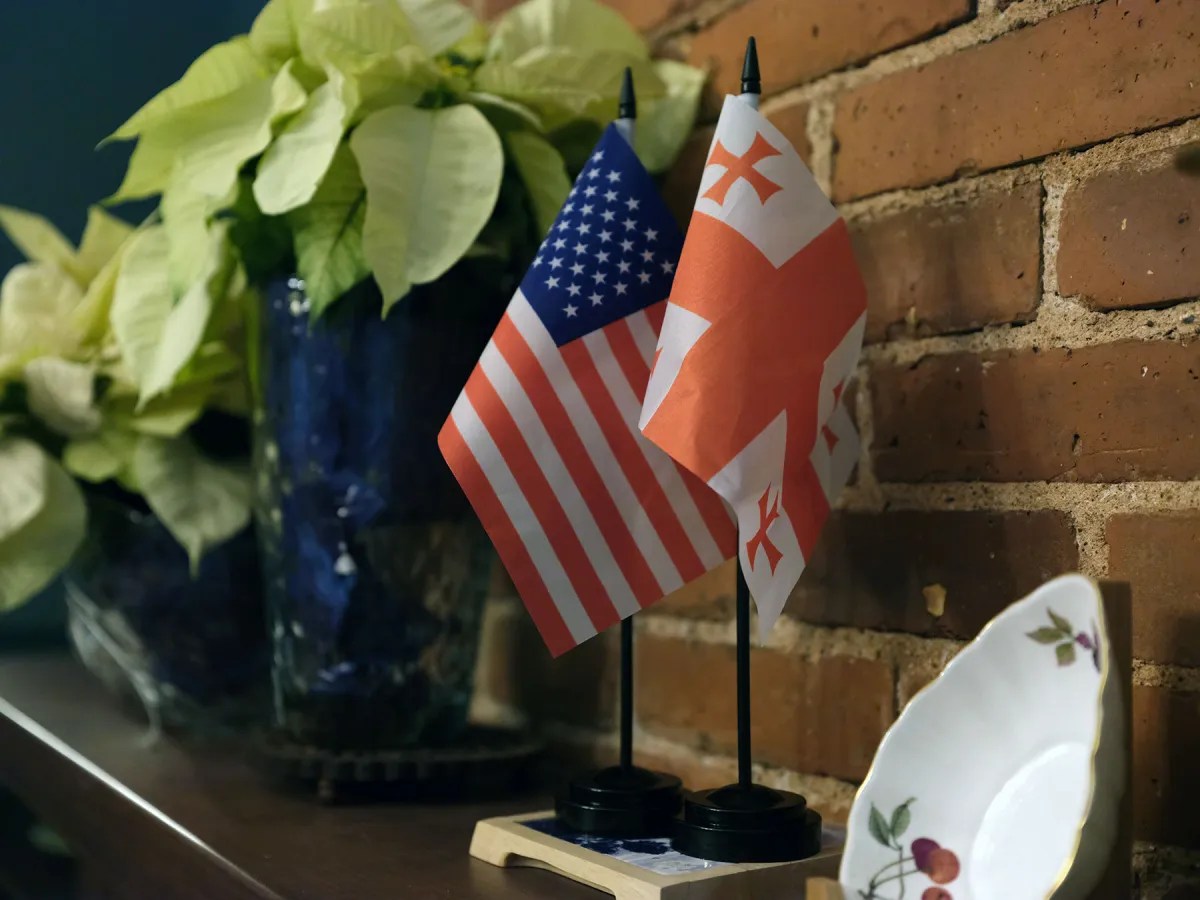 Georgian and US flags decorate the mantle at a Rotary Club host family home.
