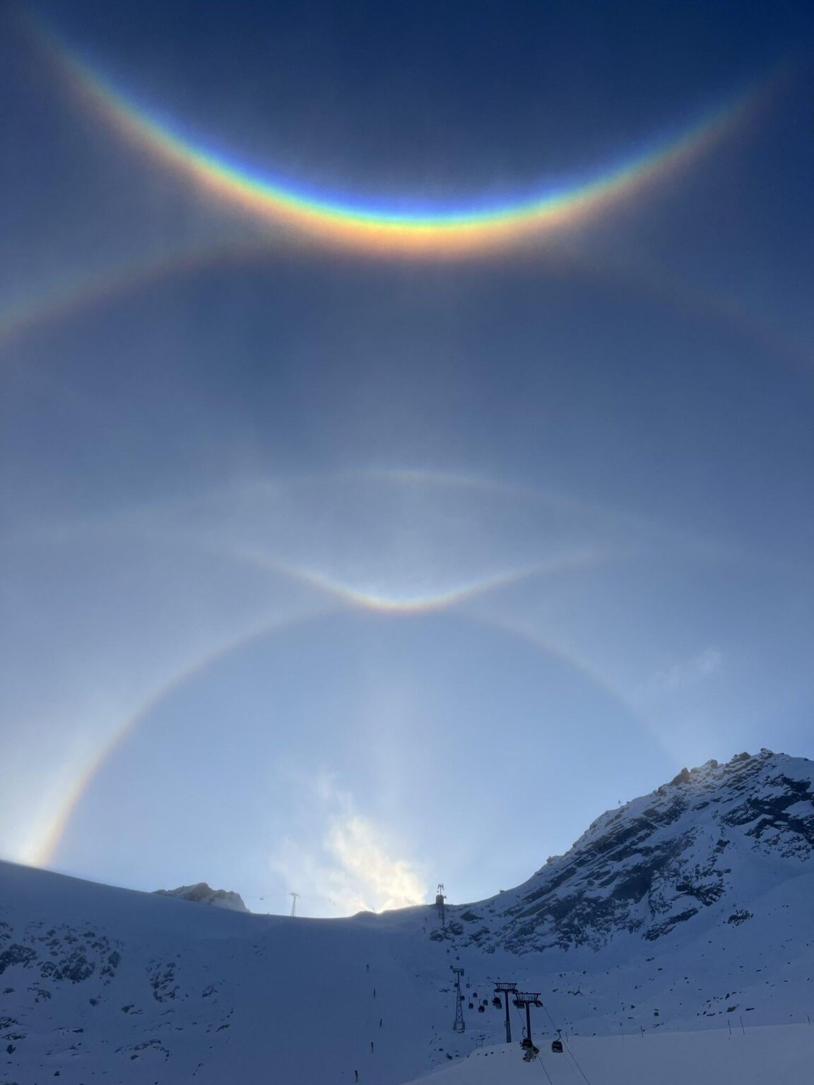 Ice crystal/sun halos seen today in the Austrian Alps (Ötztal)