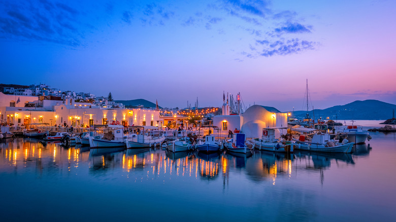 Traditional Greek houses lit up at sunset on Paros island