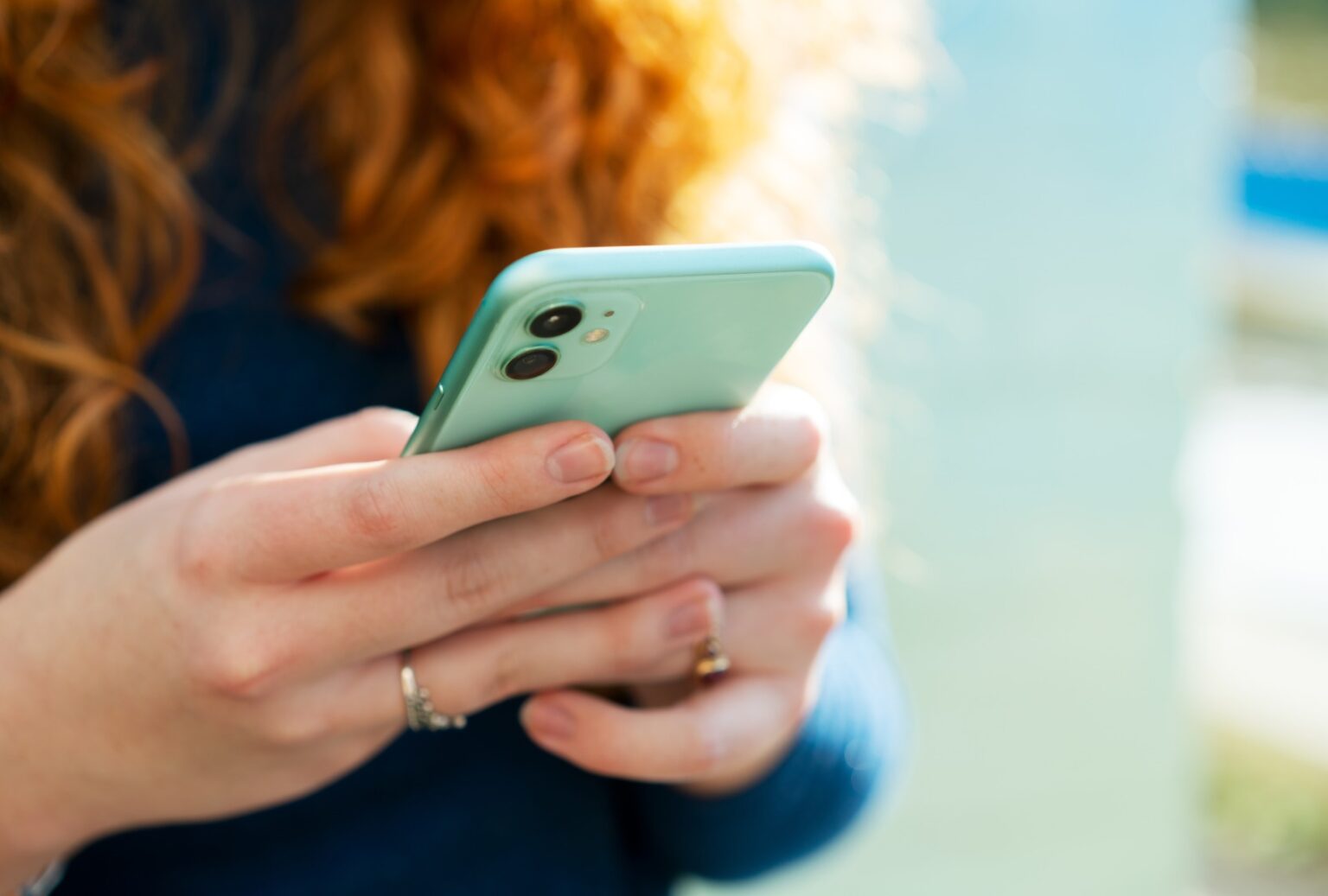 Woman holding phone. (Tim Robberts/Getty images)