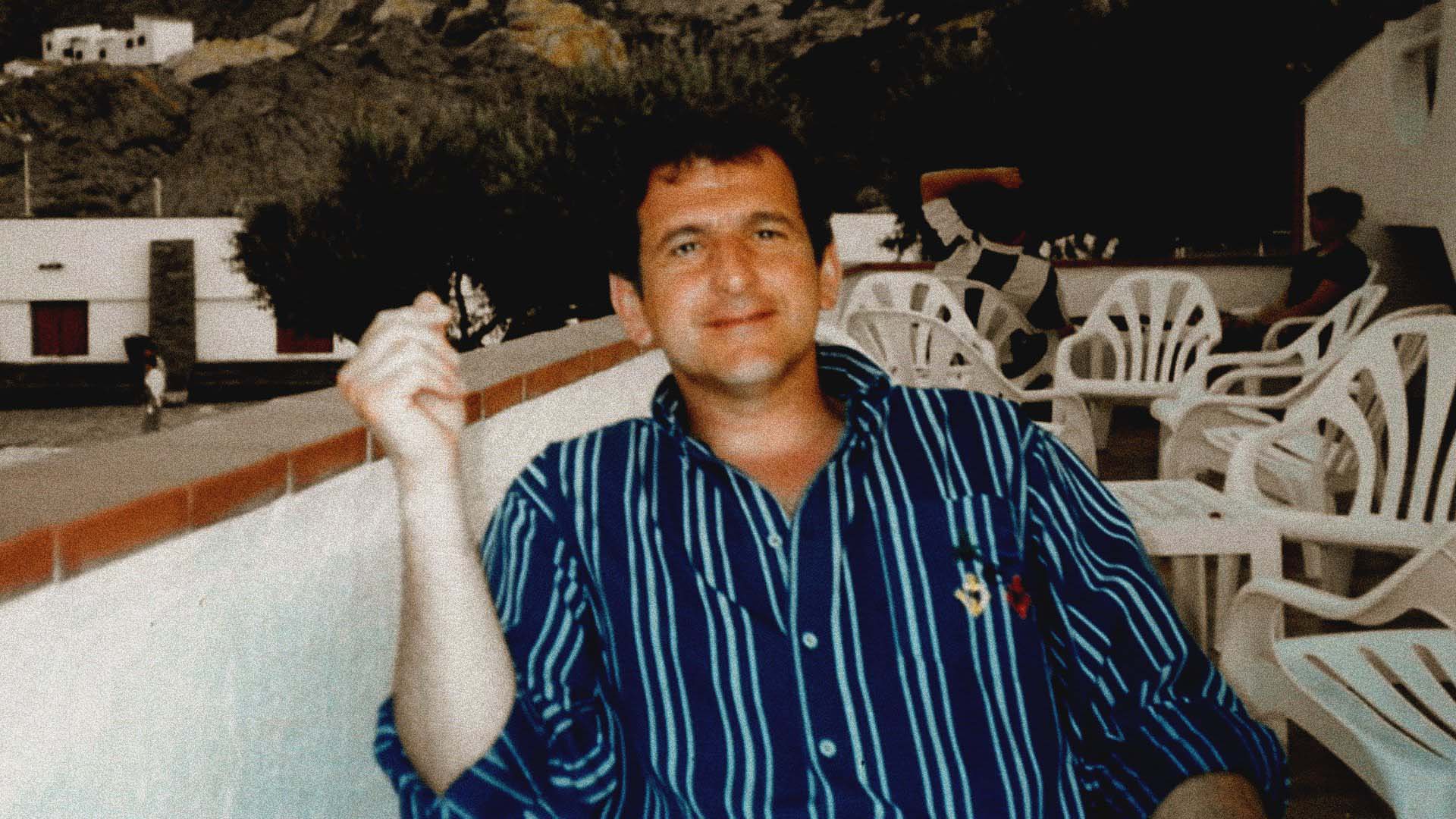Richard Alessandri, husband of Edwige Alessandri, smiling while seated outdoors.