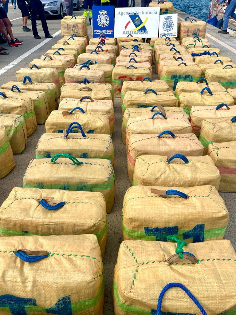 Numerous large, rectangular packages, possibly drugs, seized by the National Police and Tax Agency.