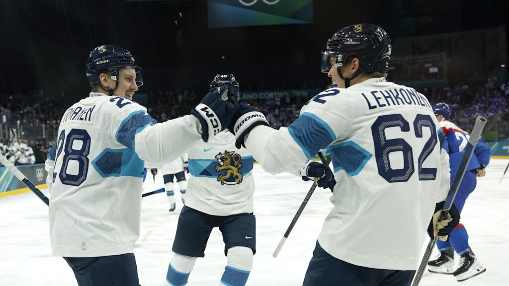 Feb 11, 2026; Milan, Italy;  Eeli Tolvanen of Finland celebrates scoring their first goal with Artturi Lehkonen of Finland against Slovakia in men's ice hockey group B play during the Milano Cortina 2026 Olympic Winter Games at Milano Santagiulia Ice Hockey Arena. Mandatory Credit: Geoff Burke-Imagn Images