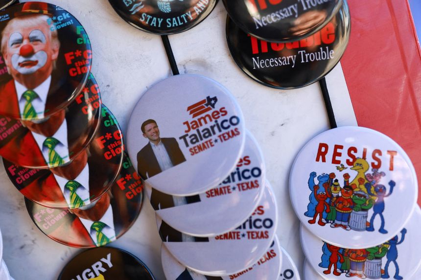 Campaign pins are displayed at a rally for James Talarico in El Paso, Texas, on February 21.
