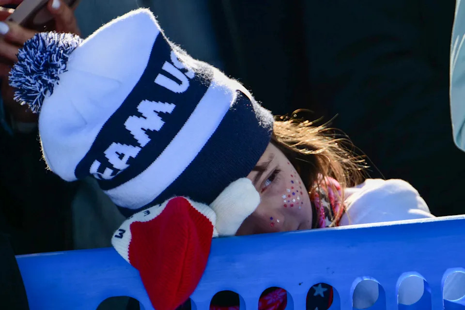 A Team USA supporter looks on after US' Lindsey Vonn crashed and was evacuated by helicopter in the women's downhill event during the Milano Cortina 2026 Winter Olympic Games at the Tofane Alpine Skiing Centre in Cortina d'Ampezzo on February 8, 2026. (Photo by Stefano RELLANDINI / AFP via Getty Images)