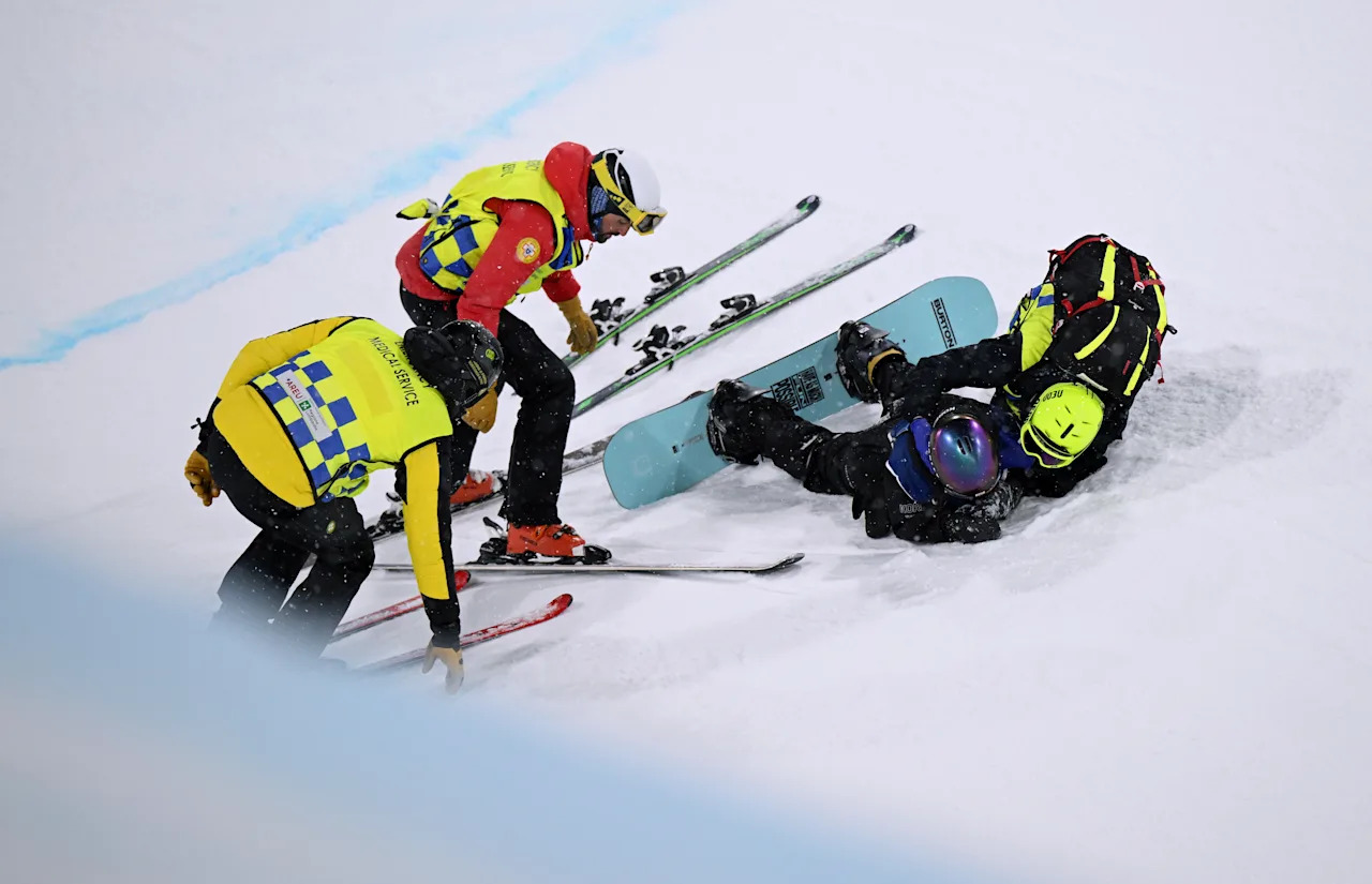 LIVIGNO, ITALY - FEBRUARY 12: Gaon Choi of Team Republic of Korea is treated by medical staff after she crashes during the Women’s Snowboard Halfpipe Final on day six of the Milano Cortina 2026 Winter Olympic games at Livigno Snow Park on February 12, 2026 in Livigno, Italy. (Photo by Hannah Peters/Getty Images)