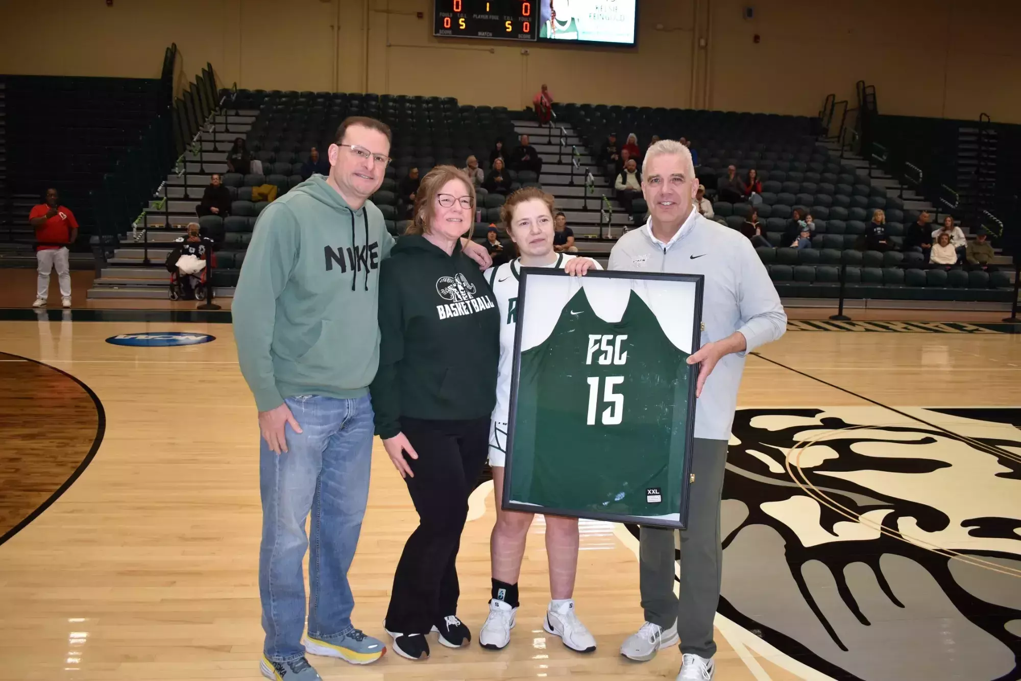 2026 Women's Basketball Senior Day - Kelsie Feingold with family and coach