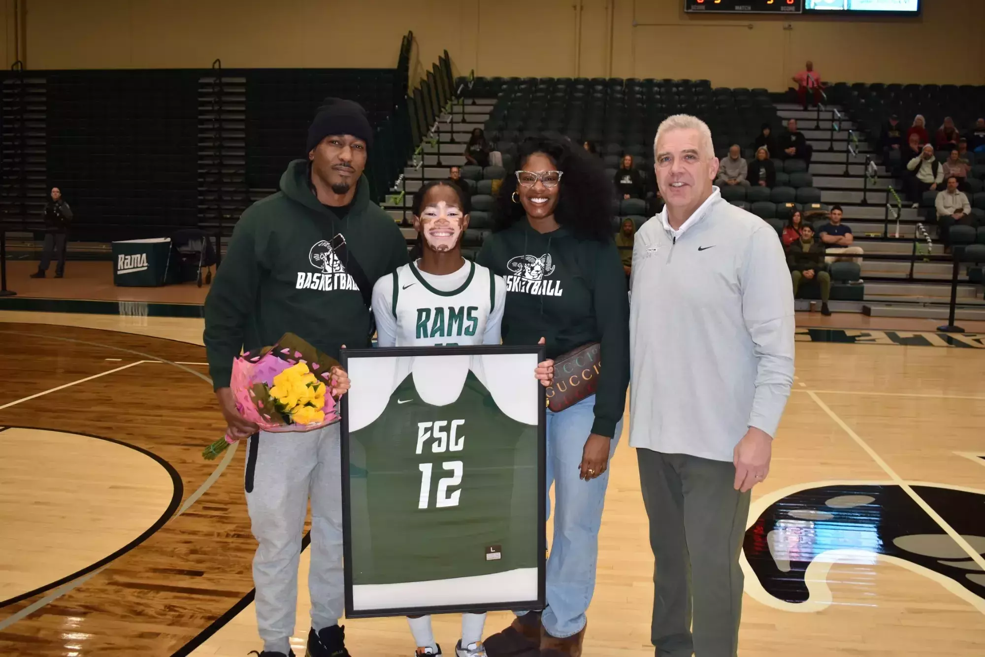 2026 Women's Basketball Senior Day - Shyann Parker with family and coach