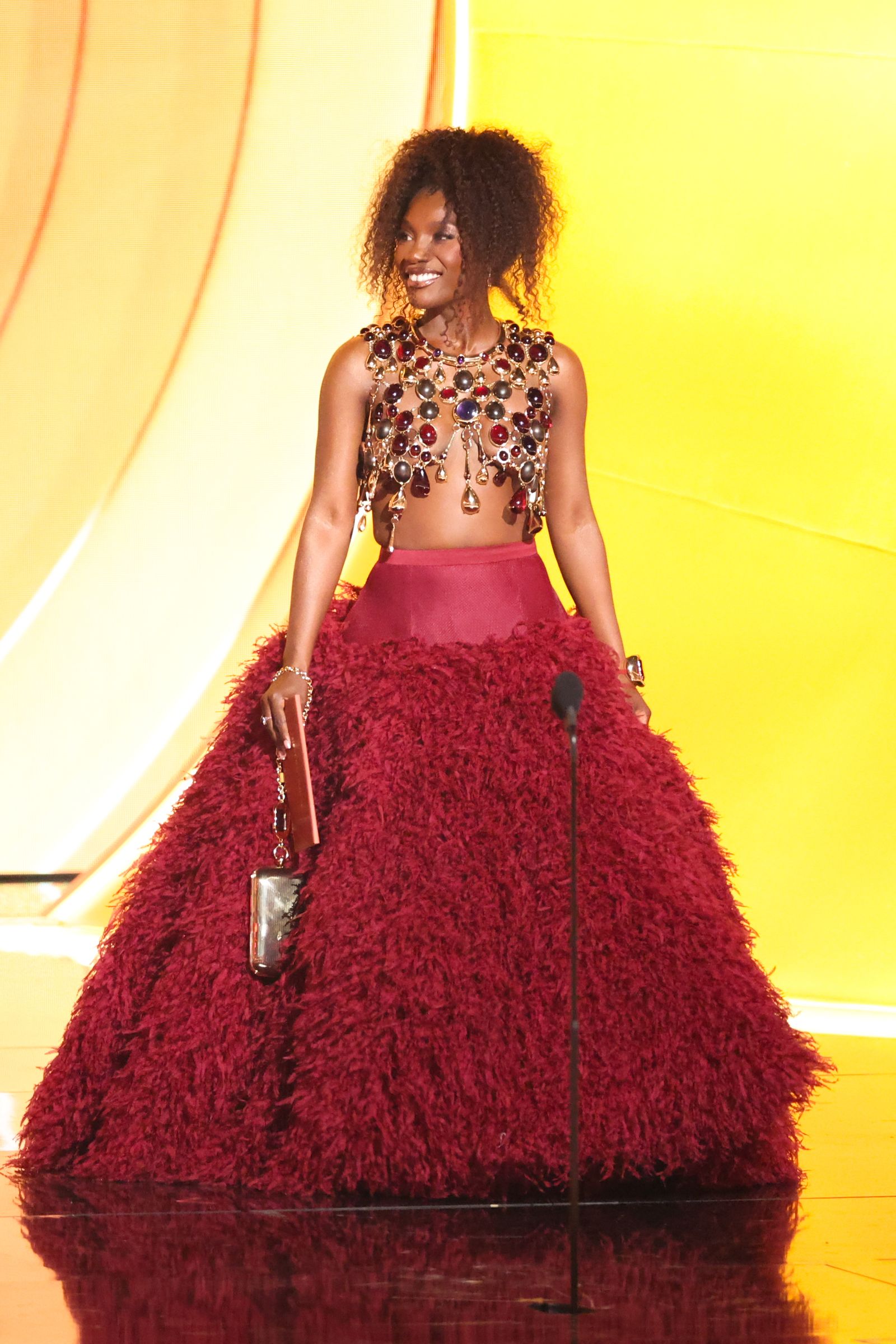 Image may contain Michaela Coel Fashion Clothing Dress Performer Person Solo Performance Formal Wear Adult and Gown