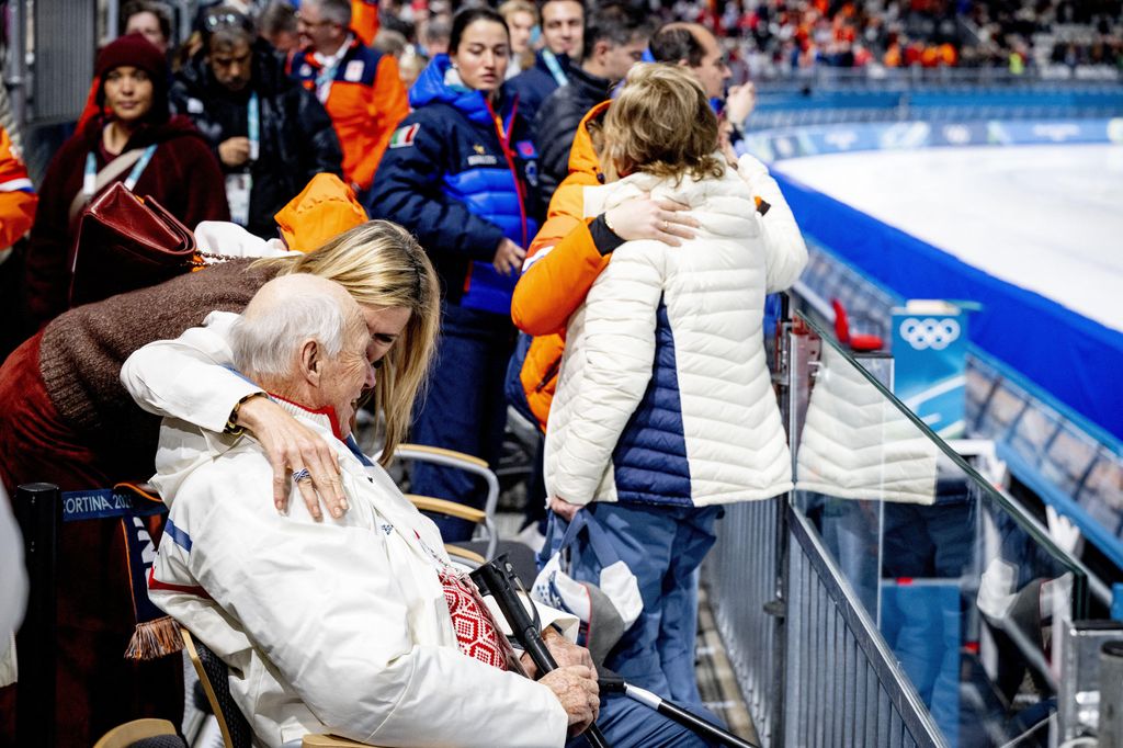 Queen Maxima of the Netherlands greeting King Harald of Norway with a hug 