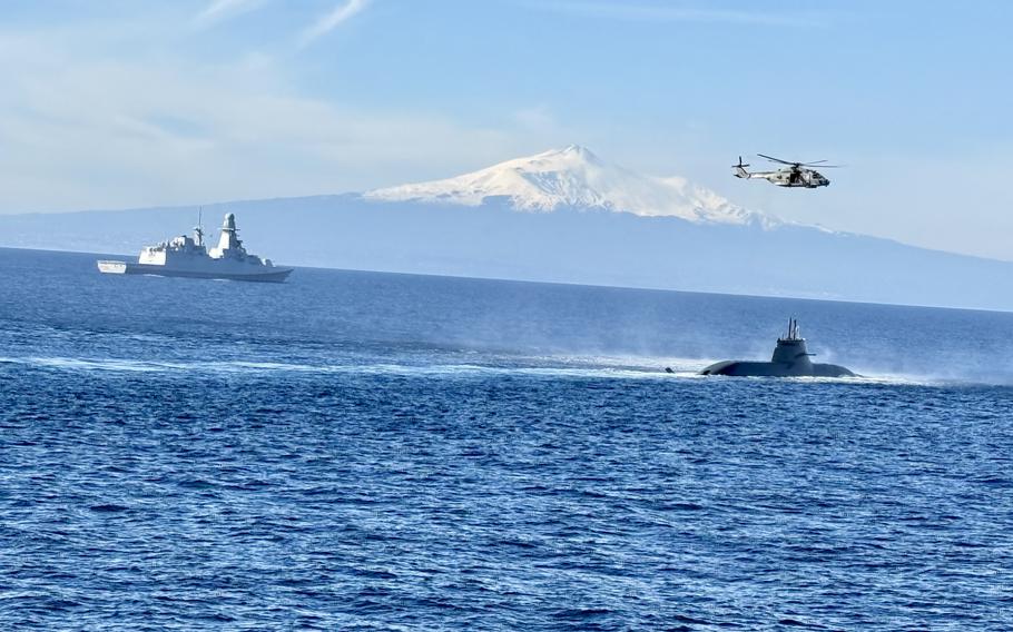 A submarine travels through the sea.