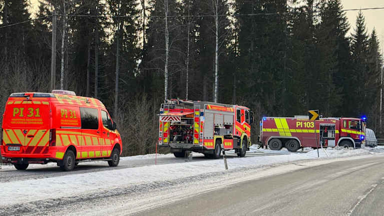 Photo shows an ambulance and a fire truck at the scene of an accident.