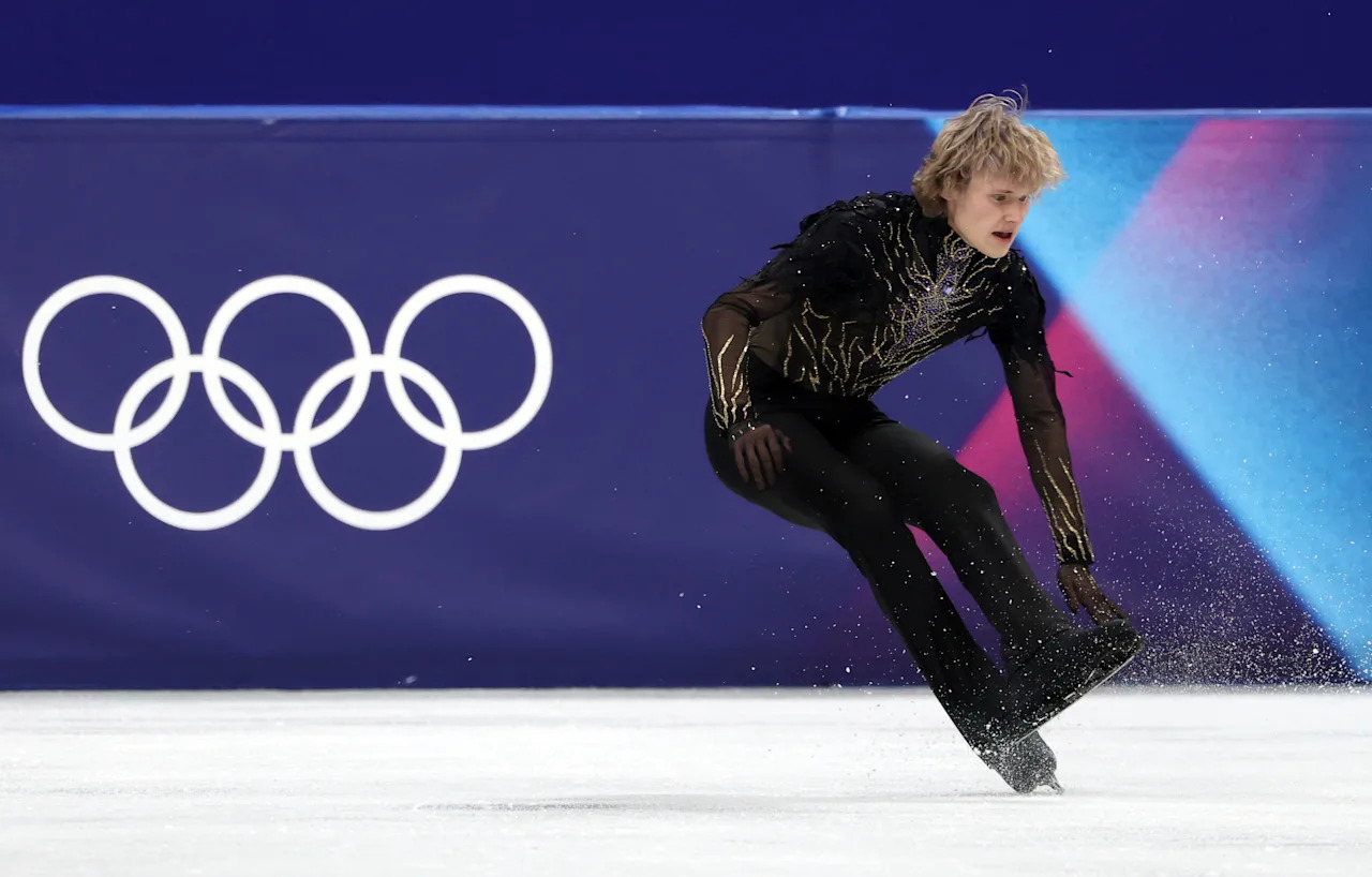 MILAN, ITALY - FEBRUARY 13: Ilia Malinin of Team United States falls over in the Men Single Skating on day seven of the Milano Cortina 2026 Winter Olympic games at Milano Ice Skating Arena on February 13, 2026 in Milan, Italy. (Photo by Jamie Squire/Getty Images)