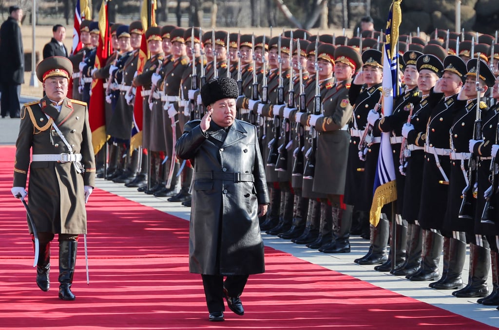 North Korean leader Kim Jong-un returns the guard of honour salute at the Ministry of National Defence on Sunday. Photo: KCNA/AFP
