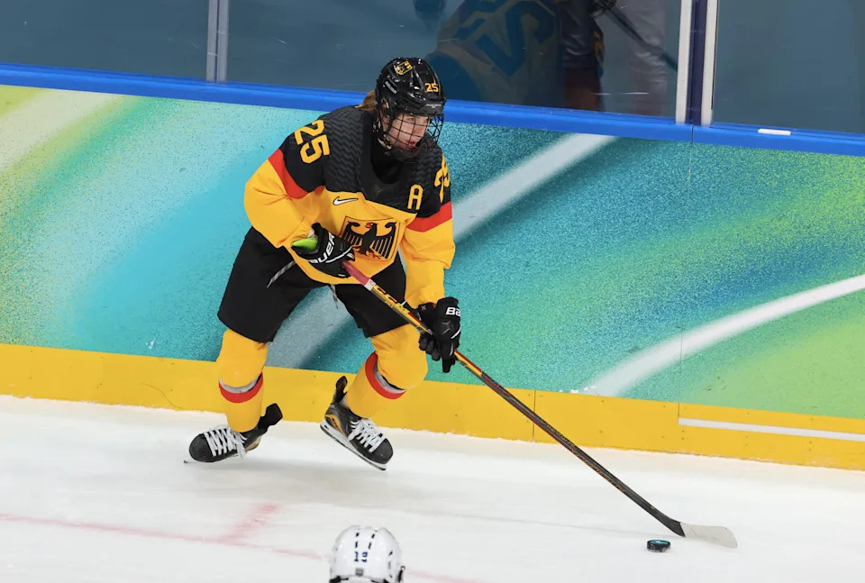 MILAN, ITALY - FEBRUARY 09: Laura Kluge #25 of Team Germany skates with the puck during the Women's Ice Hockey - Group B match between Team Germany and Team France on day three of the Milano Cortina 2026 Winter Olympic games at Milano Rho Ice Hockey Arena on February 09, 2026 in Milan, Italy. (Photo by Xavier Laine/Getty Images)