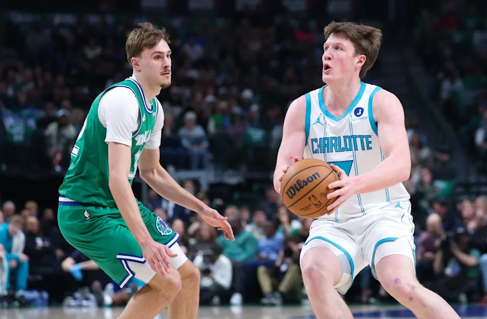 Charlotte Hornets guard Kon Knueppel (7) shoots as Dallas Mavericks forward Cooper Flagg (32) defends during the first quarter at American Airlines Center in Dallas, Texas on Jan. 29, 2026.