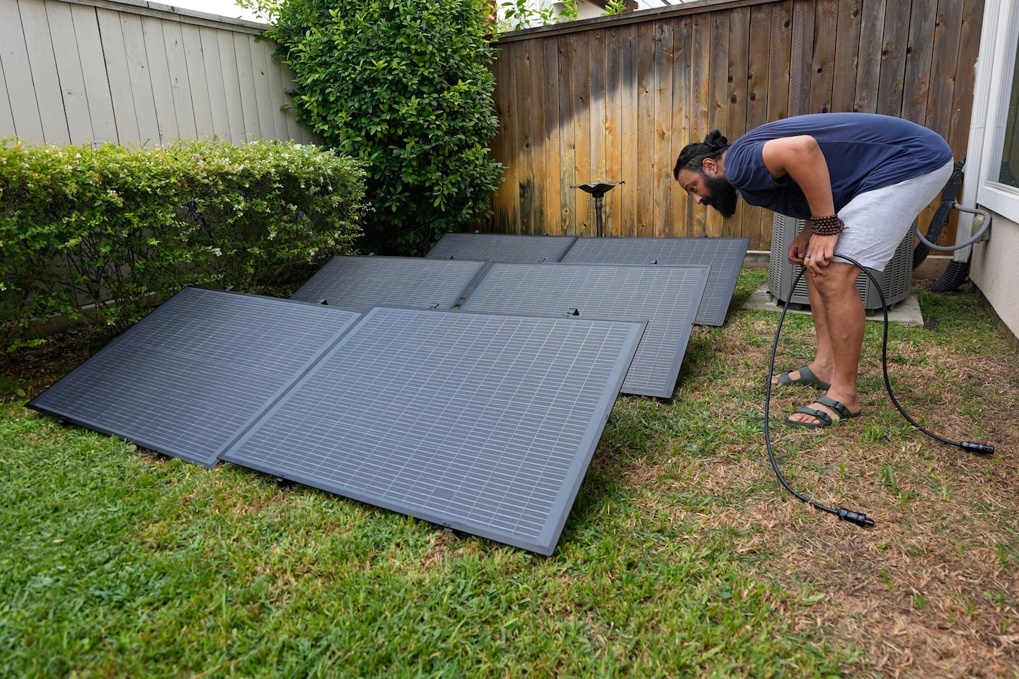 Bhavin Misra assembles a Craftstrom Solar plug-in kit at his home in Houston.