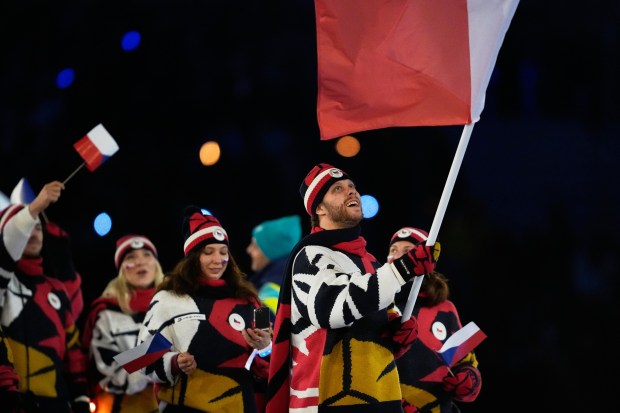 David Pastrnak, flag bearer of Czechia arrives during the Olympic opening ceremony at the 2026 Winter Olympics, in Milan, Italy, Friday, Feb. 6, 2026. (AP Photo/Ashley Landis)