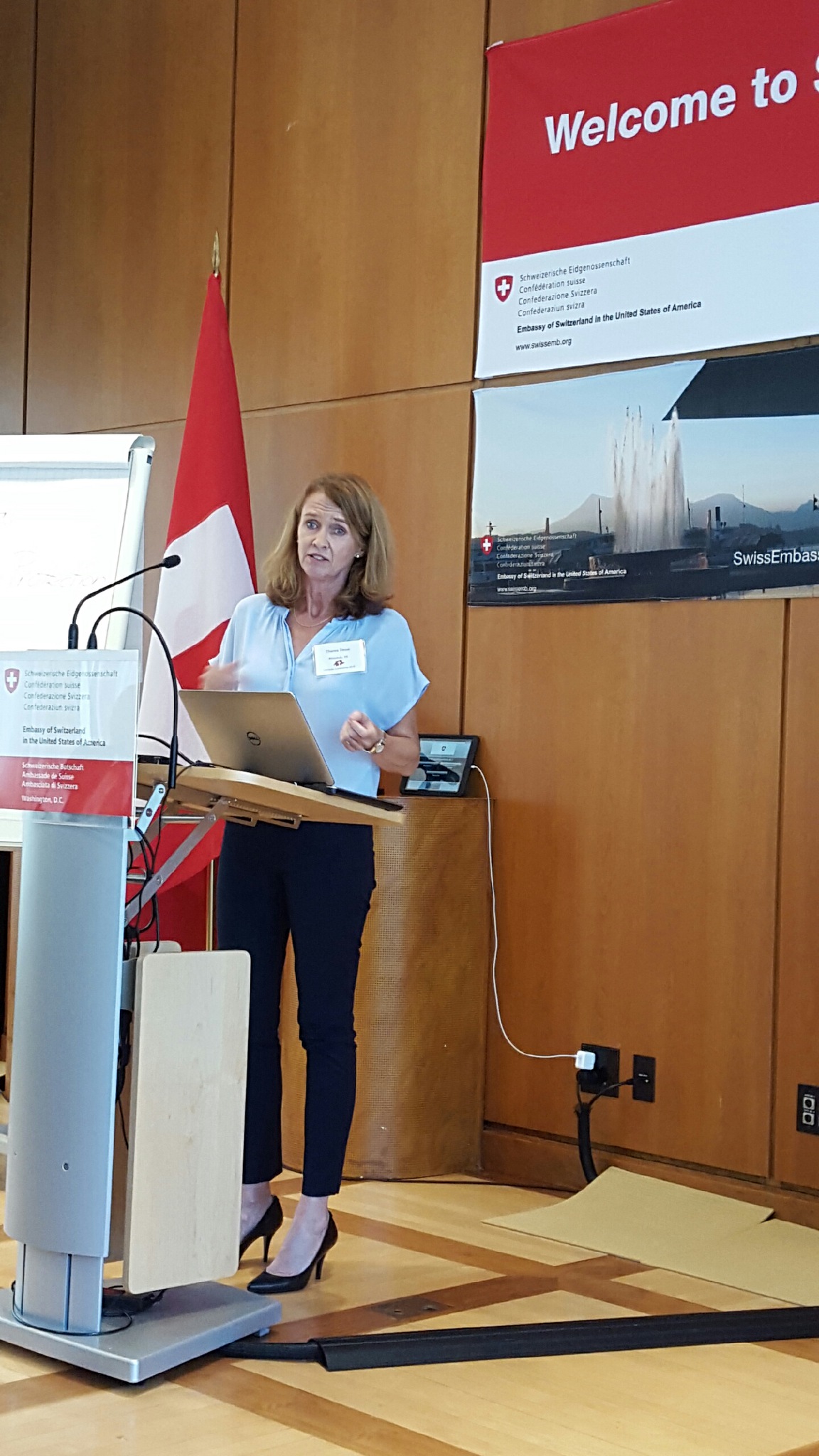 A woman speaking at a lectern