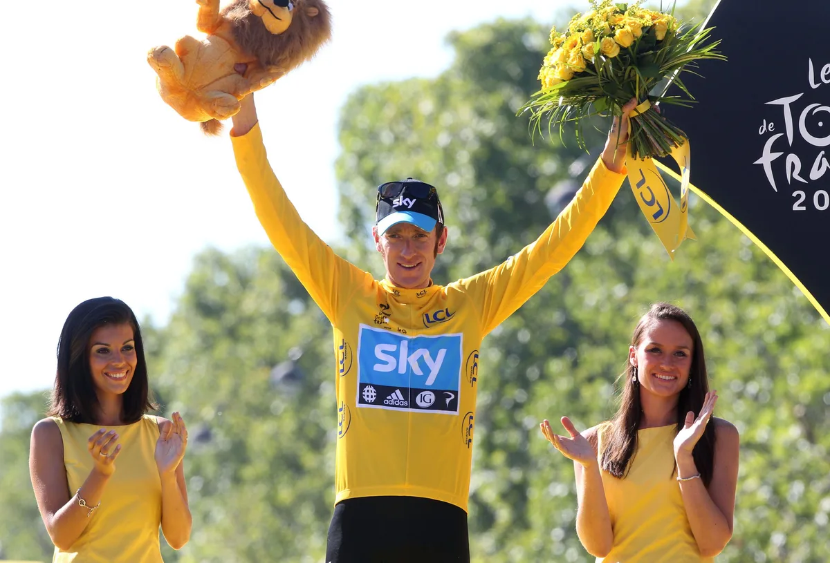PARIS, FRANCE - JULY 22: Bradley Wiggins of Great Britain and Sky Procycling receives the last yellow jersey during the trophy ceremony, after the twentieth and final stage of the 2012 Tour de France, from Rambouillet to the Champs-Elysees on July 22, 2012 in Paris, France. (Photo by John Berry/Getty Images)