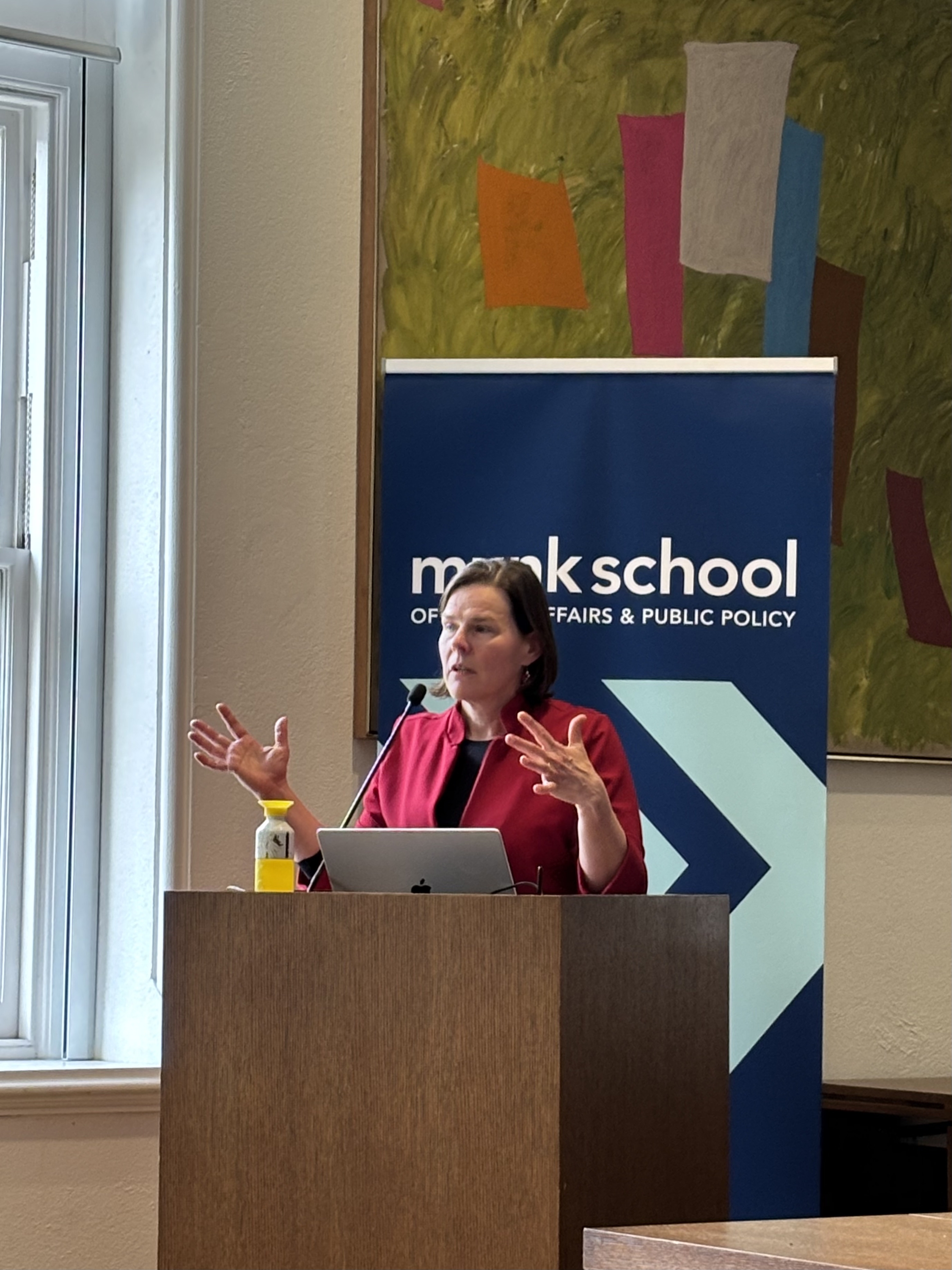 woman standing at podium speaking