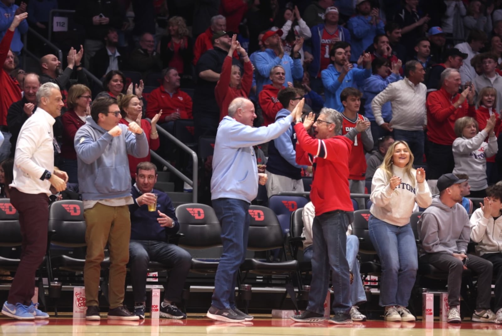 Dayton fans celebrate after a basket in the first half against Saint Louis on Tuesday, Feb. 24, 2026, at UD Arena. David Jablonski/Staff
