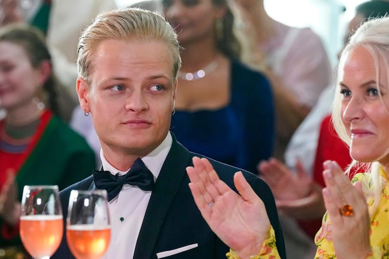 Norway's Marius Borg Hoiby with his mother, Crown Princess Mette-Marit, in Oslo, June 16, 2022.
