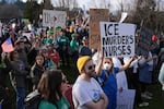 Geovanna Lopez, a nurse, holds up a sign saying "ICE Murders Nurses" at the "Labor Against ICE" protest in Portland on Saturday, Jan. 31, 2026.