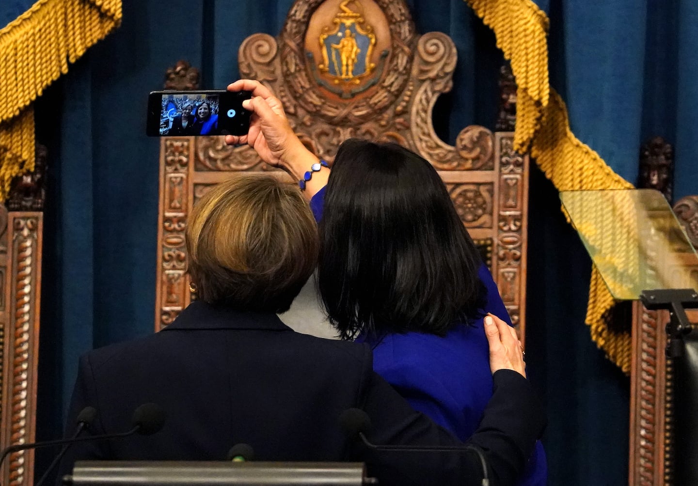 Governor Maura Healey, seen here taking a selfie with Lieutenant Governor Driscoll during her first State of the Commonwealth address, has regularly posted her own content online.
