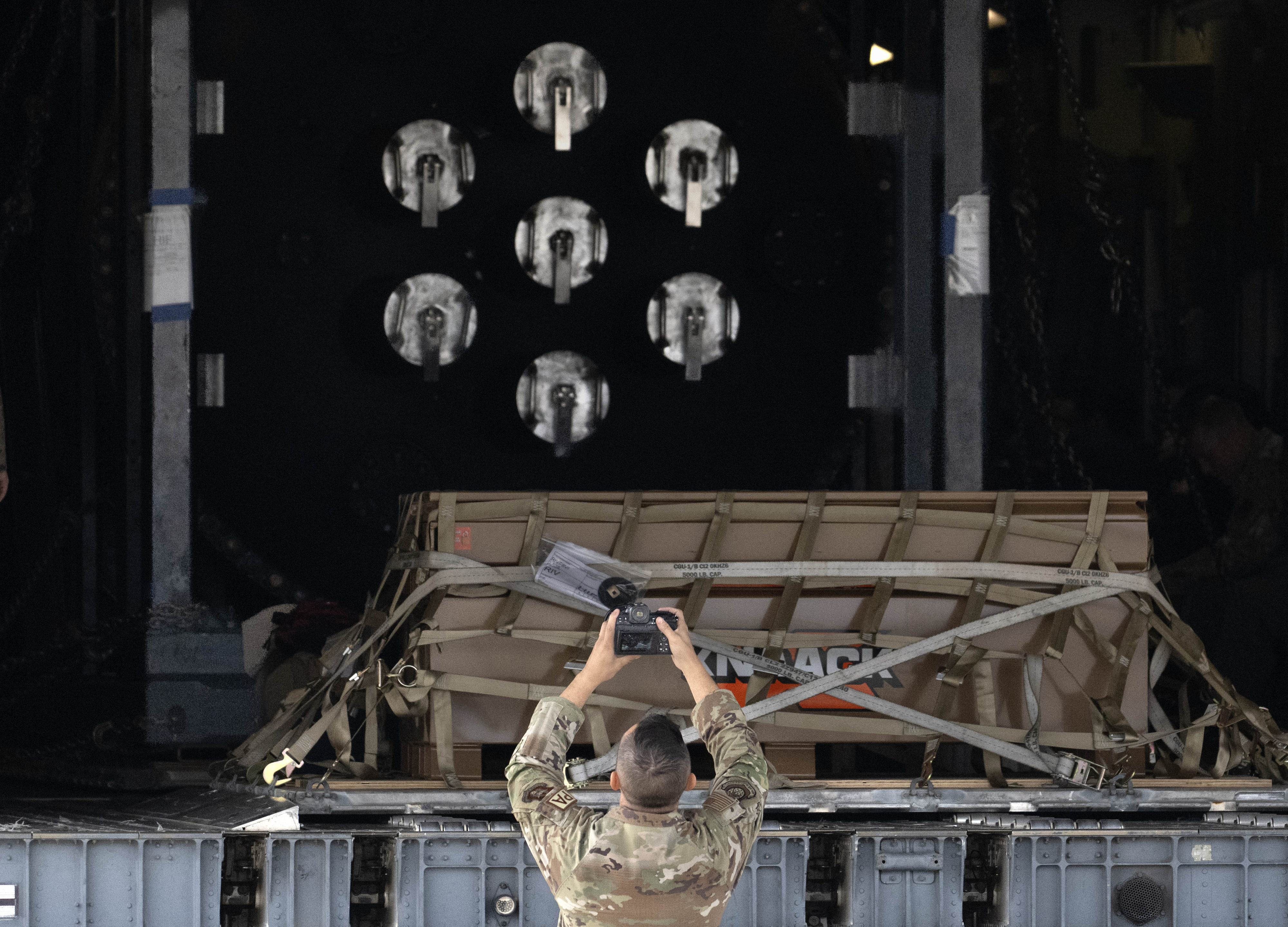 Before the cargo bay of an Air Force C-17 is...