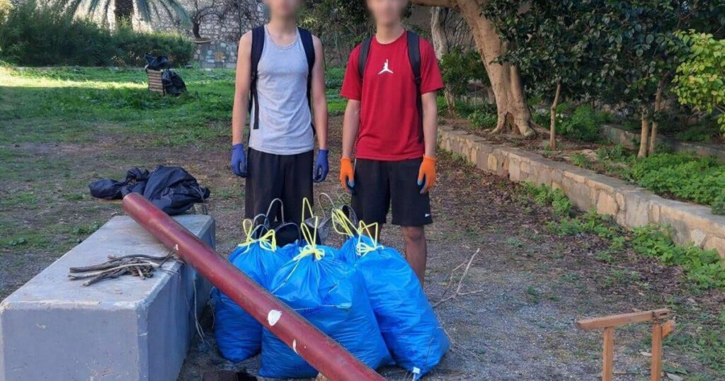 Two students cleaned the park where they go and play sports by themselves
