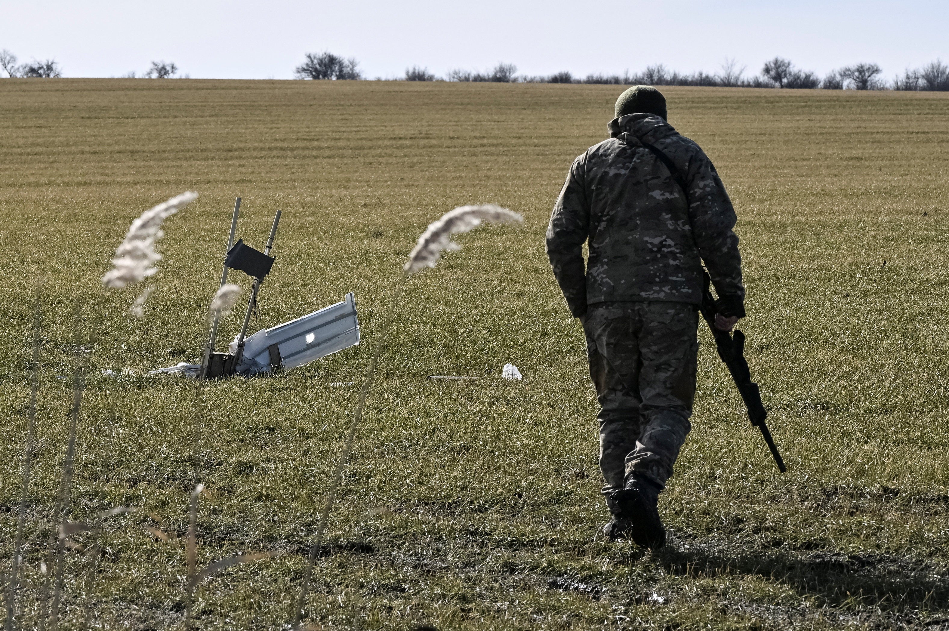 Ukrainian serviceman looks at an unexploded Russian combat drone, amid Russia's attack on Ukraine, in Zaporizhzhia region, Ukraine February 22, 2026