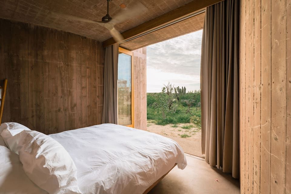 Image may contain Indoors Interior Design Bed Furniture Appliance Ceiling Fan Device and Electrical Device