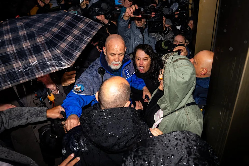 A mother who lost her son in the fire confronts co-owner of Le Constellation (AFP/Getty)
