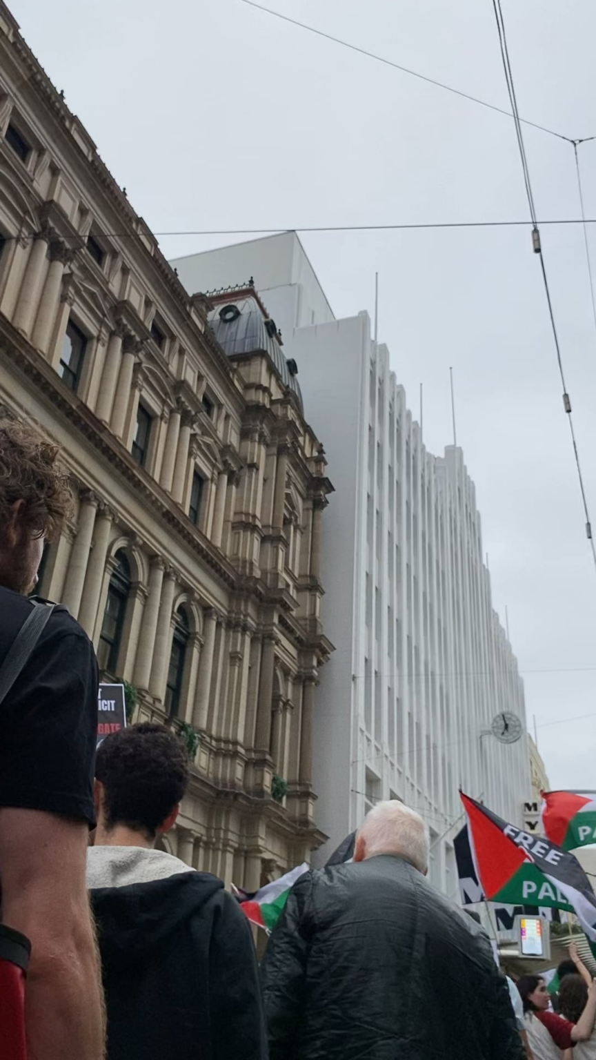 Protestors marching through CBD