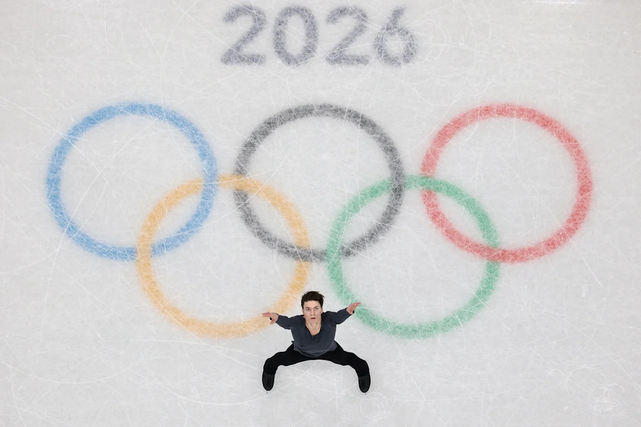 MILAN, ITALY - FEBRUARY 13: (EDITORS NOTE: Image was captured using a robotic camera positioned above the field of play.) Maxim Naumov of Team United States competes in the Men Single Skating on day seven of the Milano Cortina 2026 Winter Olympic games at Milano Ice Skating Arena on February 13, 2026 in Milan, Italy. (Photo by Sarah Stier/Getty Images)