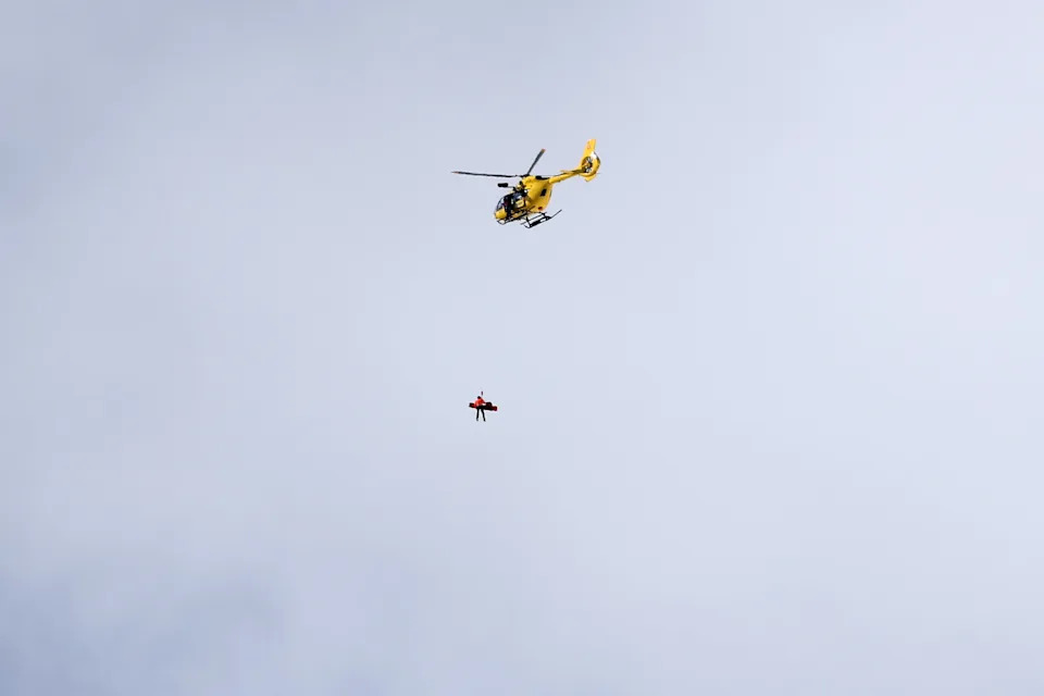CORTINA D'AMPEZZO, ITALY - FEBRUARY 08: A mountain rescue helicopter is seen rescuing Lindsey Vonn of Team United States after she crashed during the Women's Downhill on day two of the Milano Cortina 2026 Winter Olympics at Tofane Alpine Skiing Centre on February 08, 2026 in Cortina d'Ampezzo, Italy. (Photo by Ezra Shaw/Getty Images)