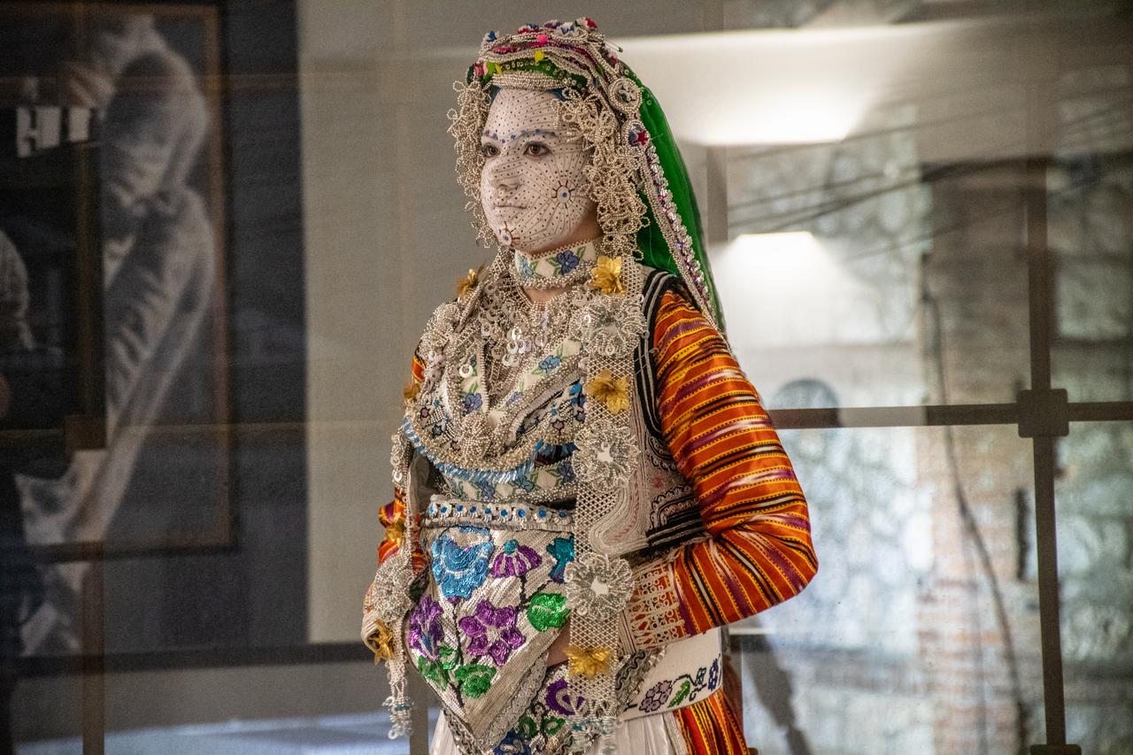 A bride’s face is carefully painted in vibrant colors as part of a traditional Bosniak wedding ritual in Prizren’s rural villages. February 3, 2026. (AA Photo)