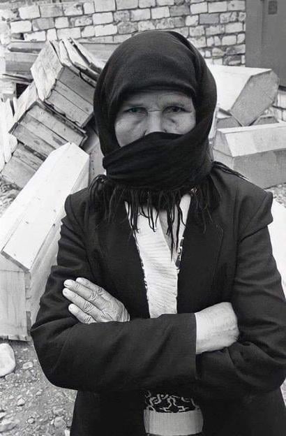 Agdam city, March, 1992. This woman, photographed by the famous photographer Oleg Litvin, according to Islamic traditions, washed the bodies of women and children who were victims of the Khojaly Genocide, then covered them with a veil called "Khafan".