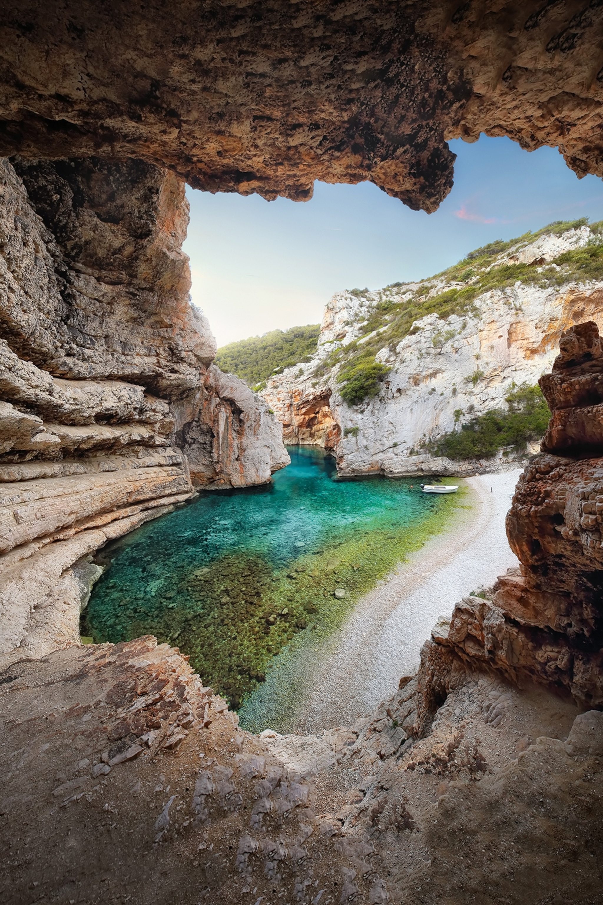 A lagoon-like beach enclosed by cliffs.