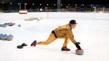 Than Tibbetts delivering a stone at Brooklyn Lakeside Curling Club. 