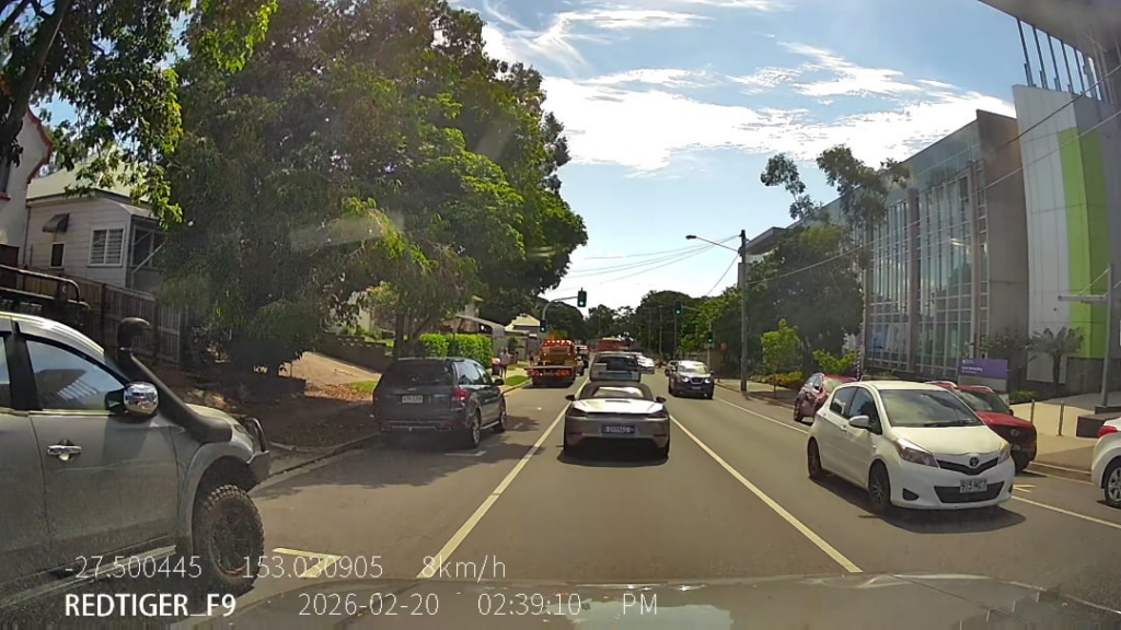How?? Top of Cornwall St. Outside P.A Hospital. 50 kph, no side-street, 3 cars, 1 on other side of the road??