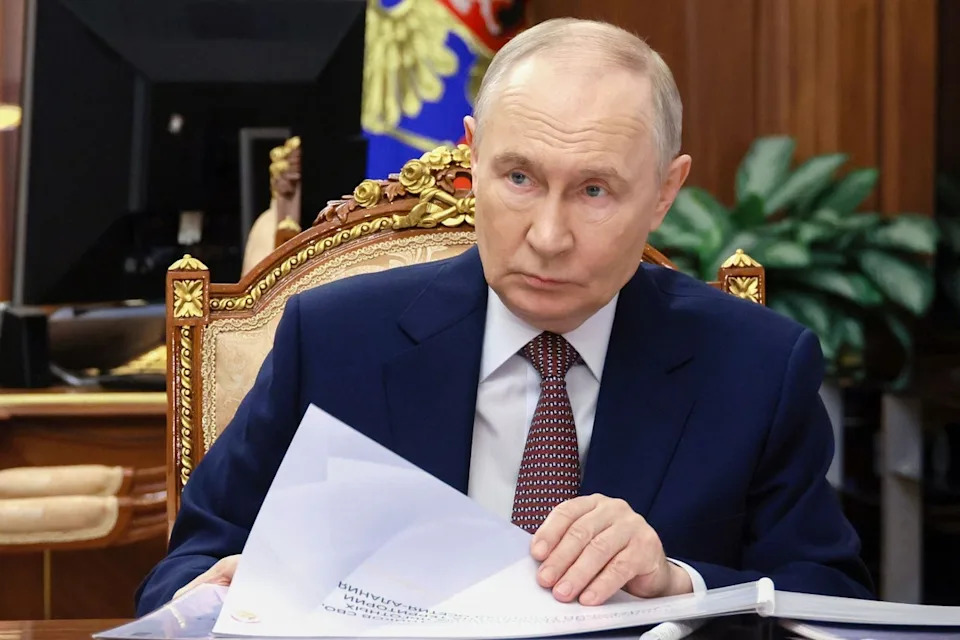 Russian president Vladimir Putin listens to the head of the North Ossetia-Alania Republic of Russia Sergei Menyailo, during their meeting at the Kremlin earlier this week (AP)