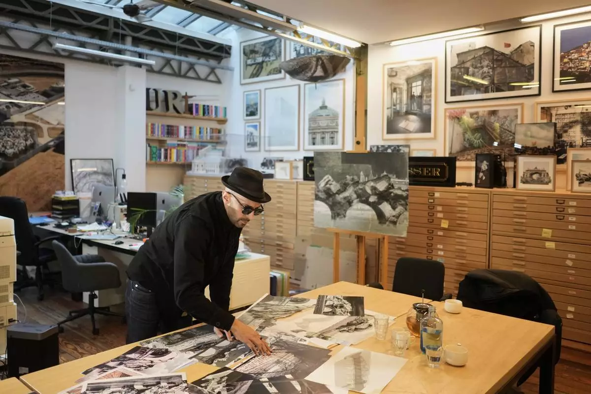 French artist JR shows his project Pont Neuf Cavern during an interview with The Associated Press in his studio, in Paris, France, Tuesday, Feb. 17, 2026. (AP Photo/Thibault Camus)