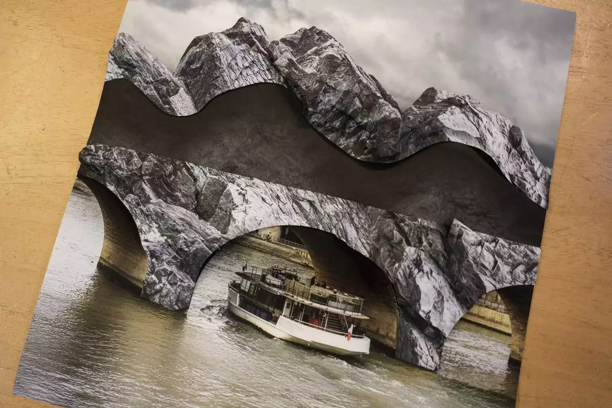 A photomontage shows the project by French artist JR called Pont Neuf Cavern in his studio, in Paris, France, Tuesday, Feb. 17, 2026. (AP Photo/Thibault Camus)