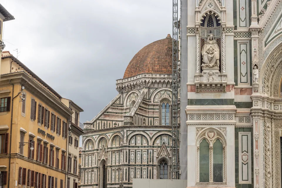 Hotel Duomo at Metropolitan Cathedral Basilica of Santa Maria del Fiore at Piazza del Duomo of Florence in Tuscany, Italy. This is a commercial business.